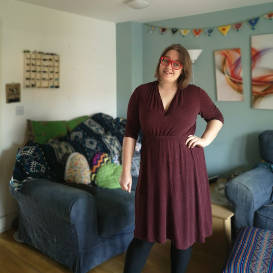 Maroon Nina Lee Mayfair Dress PDF sizes 16-28 modelled by pattern tester Laura in her living room